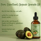 Bottle of avocado oil with avocados on a light green background