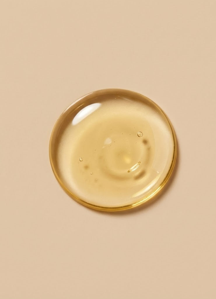 Gold circular object on a beige background