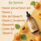 Bottle of apricot kernel oil with apricots and a list of key nutrients on a beige background