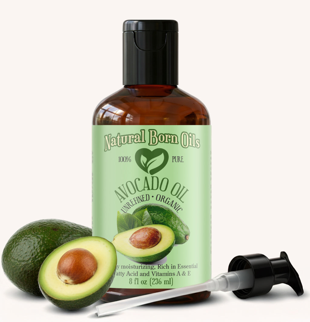 Bottle of Natural Born Oils avocado oil with a pump and two avocados on a white background