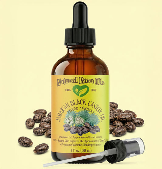 Bottle of Natural Born Oils Jamaican Black Castor Oil with dropper on a beige background