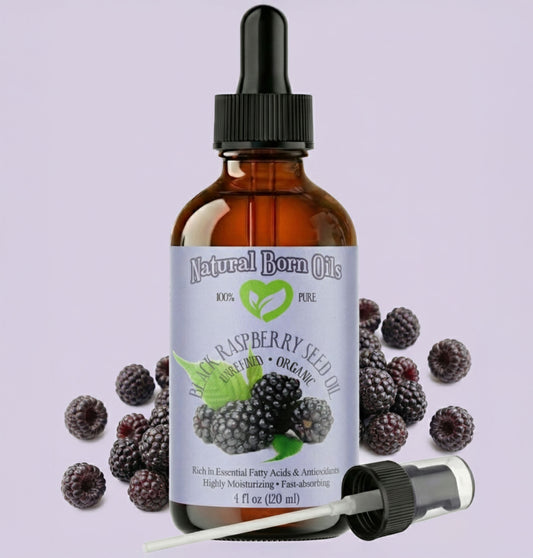 Bottle of Natural Born Oils raspberry seed oil with blackberries on a light purple background