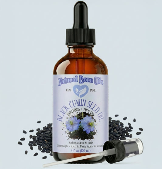 Bottle of Natural Born Oils Black Cumin Seed Oil with dropper on a light gray background