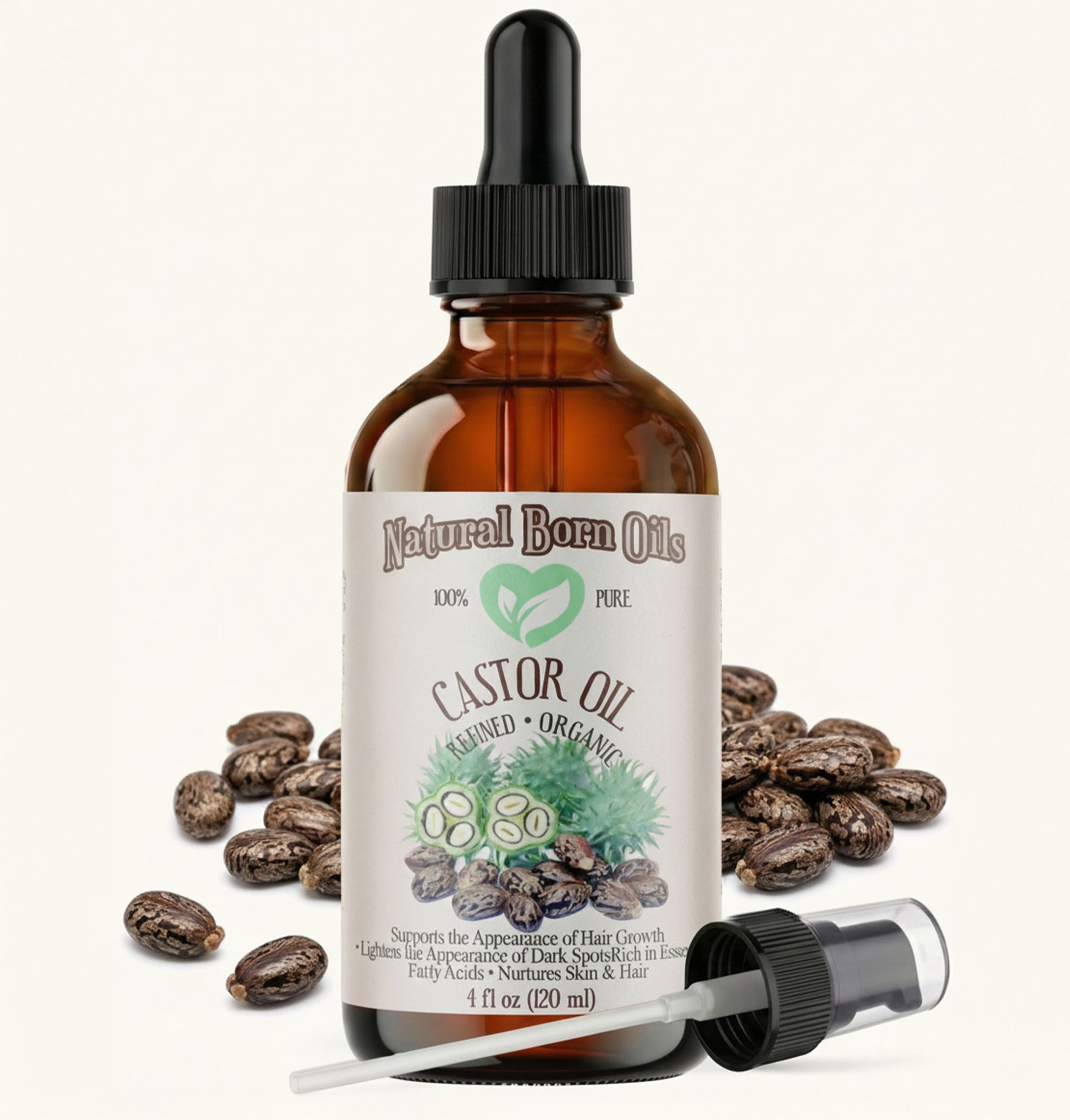 Bottle of Natural Born Oils castor oil with dropper and beans on a white background