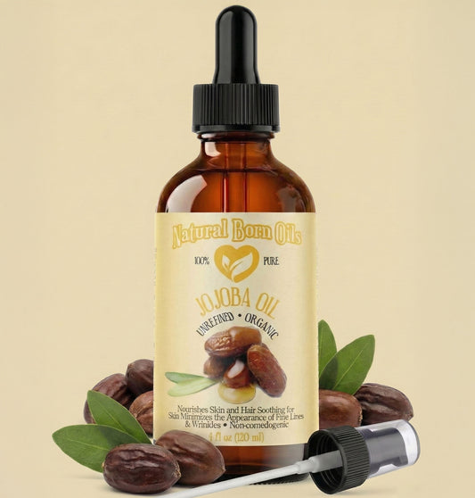 Bottle of Natural Born Oils Jojoba Oil with dropper on a beige background