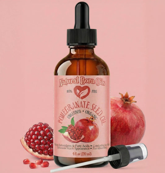 Bottle of Natural Born Oils Pomegranate Seed Oil with pomegranates on a pink background