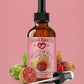Bottle of Natural Born Oils Prickly Pear Seed Oil with a pink label on a pink background