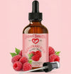 Bottle of Natural Born Oils Red Raspberry Seed Oil with a dropper on a pink background