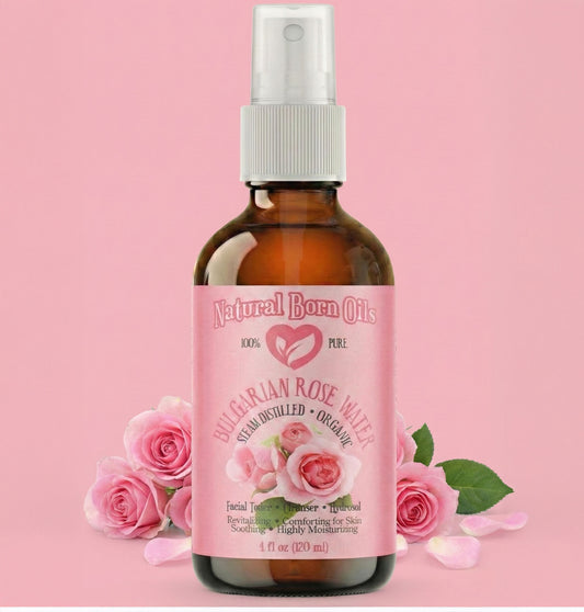 Bottle of Bulgarian Rose Water with pink roses on a pink background