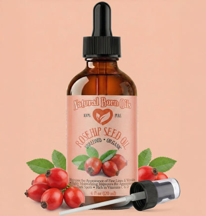 Bottle of Natural Born Oils Rosehip Seed Oil with dropper on a peach background