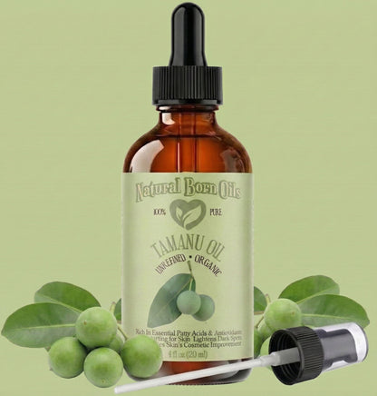 Bottle of Natural Born Oils Tamanu Oil with dropper on a green background