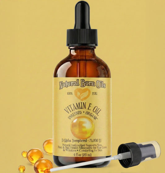 Bottle of Natural Born Oils Vitamin E Oil with dropper on a yellow background