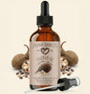Bottle of Natural Born Oils Baobab Oil with dropper on a beige background