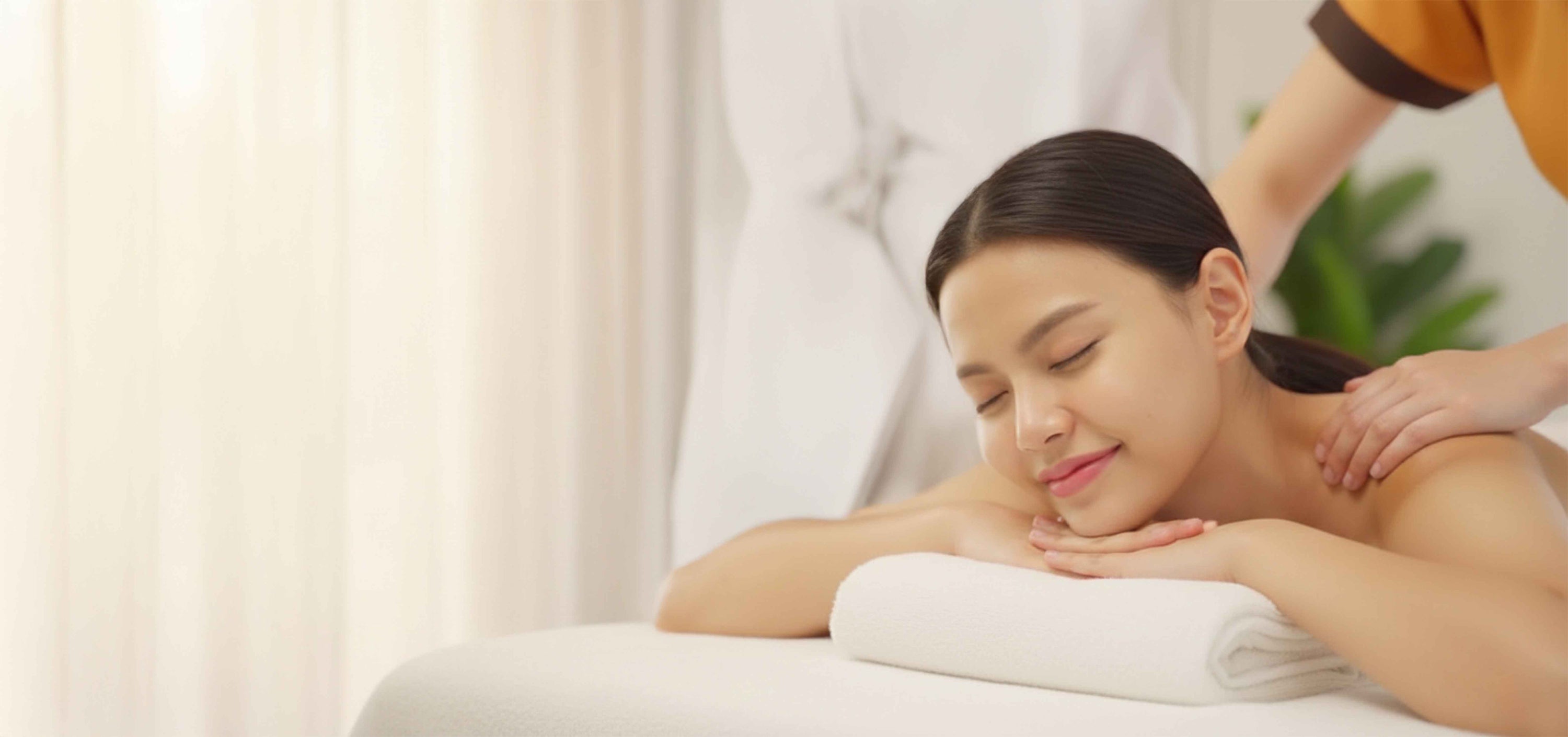 Woman receiving a massage in a spa setting